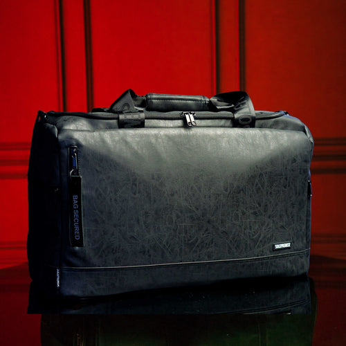 A black leather duffle bag that can hold 4 pairs of shoes