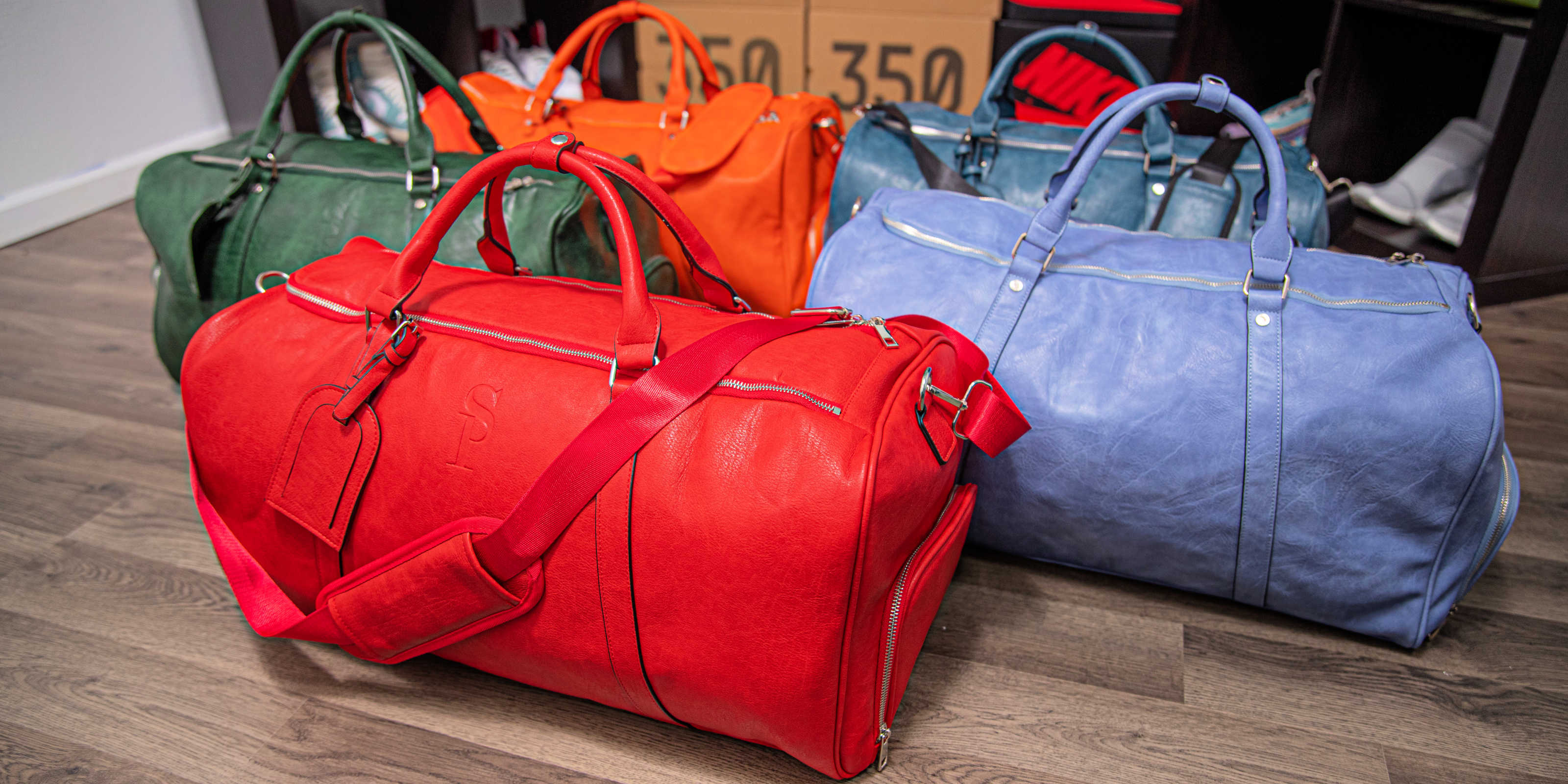 Red leather duffle bag hot sale