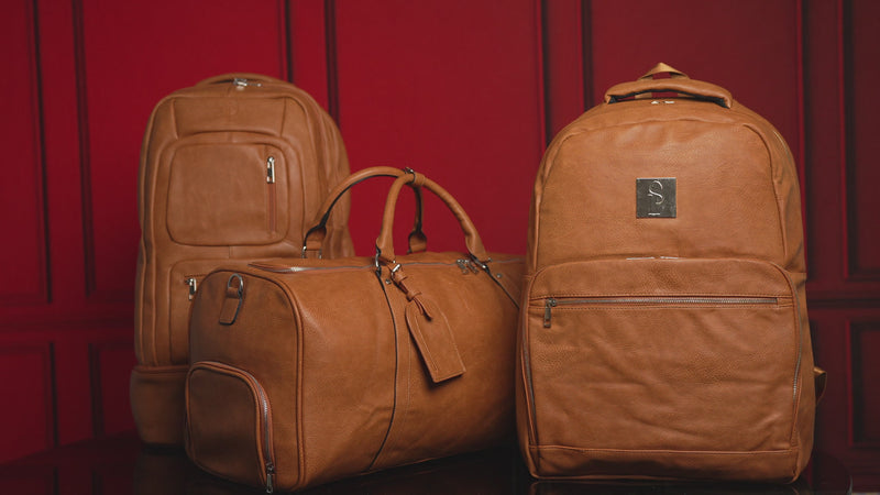 brown travel bags